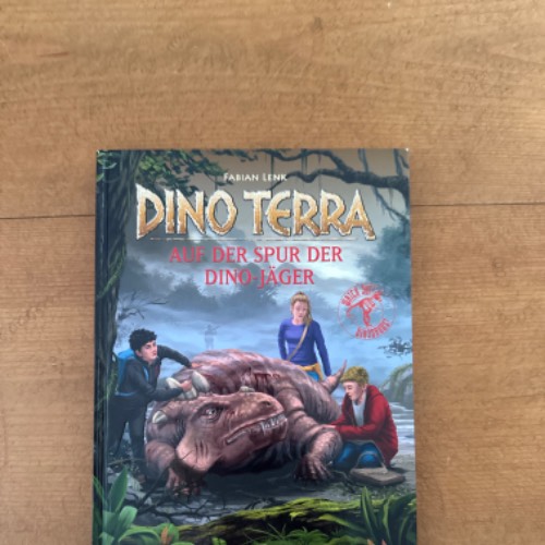 Dino Terra Dino-Jäger Buch8, zu finden beim Stand 29 am Standort Flohkids Hamburg Nord