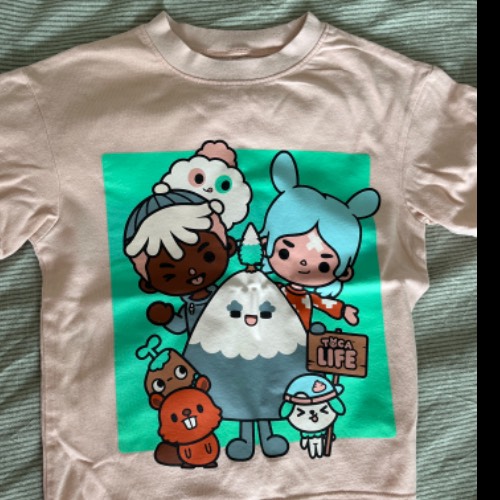 H&M T-shirt pink anime  Größe: 104, zu finden beim Stand 160 am Standort Flohkids Hamburg Nord